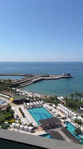 Seagulls visit resort balcony overlooking Alanya waterpark