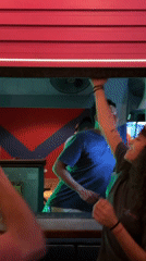 Young adults celebrate at colorful São Paulo bar