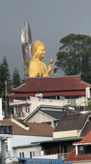 Golden Buddha statue overlooks Đà Lạt hillside town