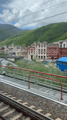 Train passenger records view of platform and river