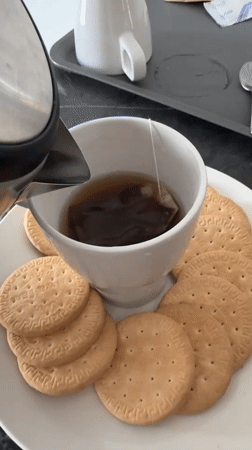 Tea and biscuits with a Kuala Lumpur skyline backdrop