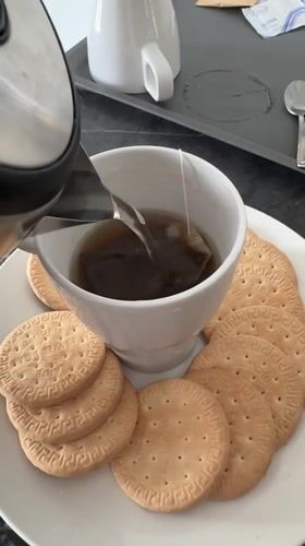Tea and biscuits with a Kuala Lumpur skyline backdrop