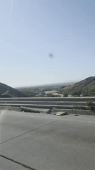 Highway drive captures roadside valley scenery in Tijuana