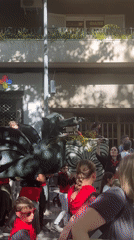 Street festival with dragon parade and music in Terrassa