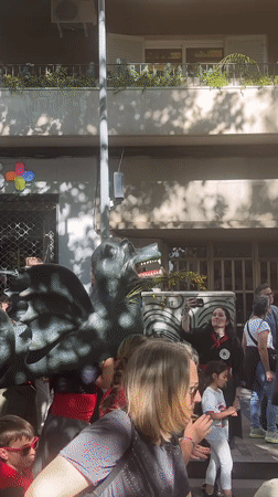 Street festival with dragon parade and music in Terrassa