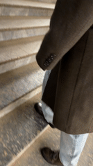 Person ascends granite stairs in Moscow building