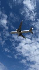 Aircraft with landing gear observed flying overhead