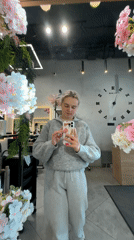 Woman takes selfie at decorated mirror in Saint Petersburg