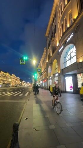 Saint Petersburg streets at dusk, wet pavement and summer light