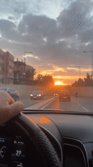 Driver navigates sunset traffic in Marrakesh, Morocco