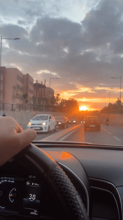 Driver navigates sunset traffic in Marrakesh, Morocco