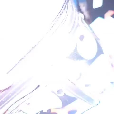 Here is a description of the video:

The video shows a ladybug-patterned cosmetics bag being unzipped to reveal several colorful, patterned headbands inside. The person opening the bag is not visible. The pattern on the bag features black background with green leaves and red ladybugs.