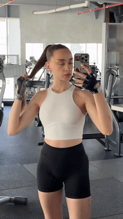 Woman takes mirror selfie at gym in Belorechensk