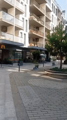 Modern street life and commercial strip in Tiachiv, Ukraine