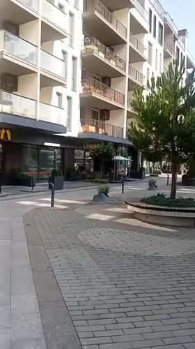 Modern street life and commercial strip in Tiachiv, Ukraine