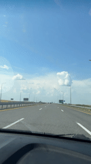 Open highway drive through rural Kazakhstan under clear skies