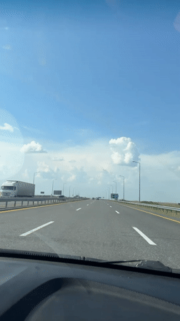 Open highway drive through rural Kazakhstan under clear skies