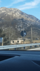 Highway travel through Montenegro countryside offers mountain views