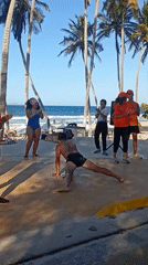 Group performs dance routines at Venezuelan beach promenade