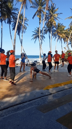 Group performs dance routines at Venezuelan beach promenade