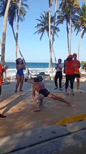 Group performs dance routines at Venezuelan beach promenade