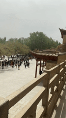 Tourist activity documented at Dunhuang's Mogao Caves and parks