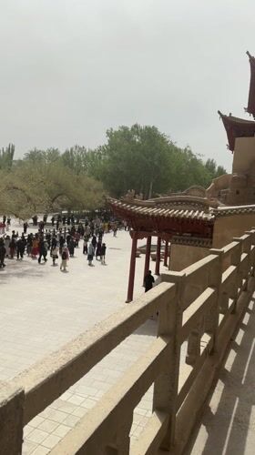 Tourist activity documented at Dunhuang's Mogao Caves and parks