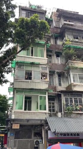 Old residential building with balcony gardens documented in Liwan District