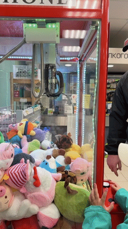 Father, child enjoy claw machine games at Chaikovsky store