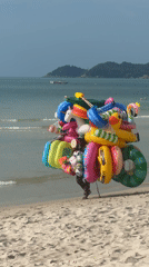 Red-tiled infinity pool and inflatable toys at Ko Samui resort