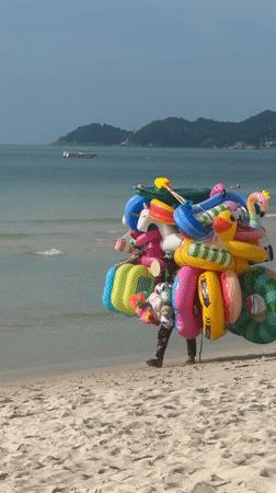 Red-tiled infinity pool and inflatable toys at Ko Samui resort
