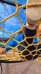 Child plays on playground equipment and stuffed animals in Russia