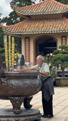Morning temple rituals and maintenance captured at Da Lat Buddhist complex