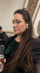 Woman in green dress spotted at Moscow metro with sparkling wine