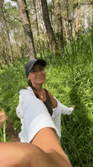 Woman documents motorcycle forest journey in Kintamani, Indonesia