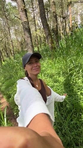 Woman documents motorcycle forest journey in Kintamani, Indonesia