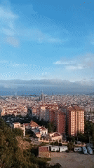 Panoramic Barcelona vista captured featuring Sagrada Familia from elevated viewpoint