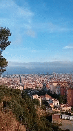 Panoramic Barcelona vista captured featuring Sagrada Familia from elevated viewpoint