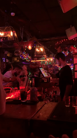 Late-night bar scene in Tel Aviv with retro decor and dancing