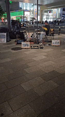 Street performers entertain crowds in busy Osaka shopping district