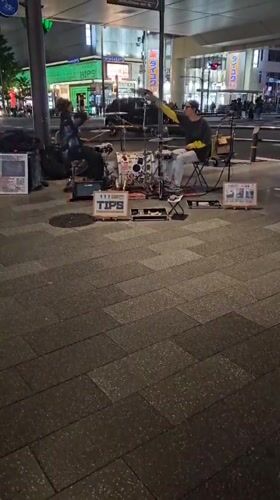 Street performers entertain crowds in busy Osaka shopping district