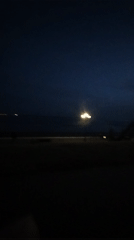 Street lamp lights dark beach scene in Saratov