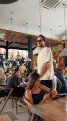 Man walks through busy restaurant in North Kuta