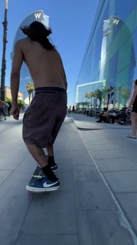 Skateboarding Barcelona's beachfront promenade on a sunny afternoon