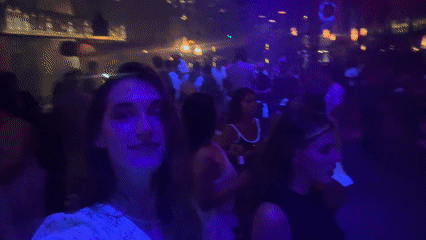 Nightclub scene captured in บ้านบางรักษ์ with DJ, dancing patrons