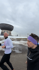 Morning joggers run along Kazan riverfront pathway