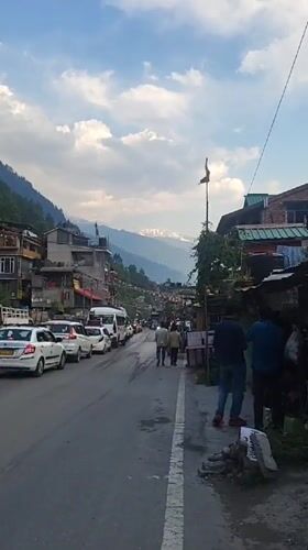 Ordinary street life documented across Manali during busy morning hours