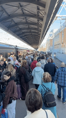 Morning commuters gather on Saint Petersburg train platform