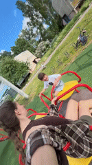 Mother and child enjoy spring afternoon at Russian village playground