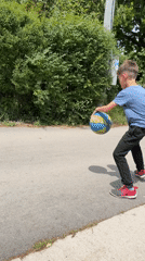 Boy dribbles basketball down Sofia street Tuesday morning